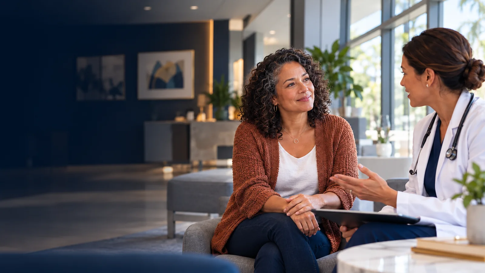 Illustrative consultation between a patient and a physician in a sunlit clinic